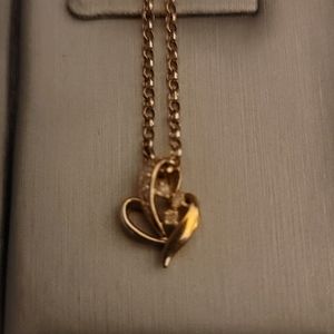 18k Gold heart shaped pendant with diamond